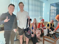 a group of people posing for a picture in a living room